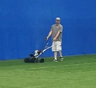 Turf Maintenance with Upright Power Broom