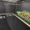 batting cage facility with black turf