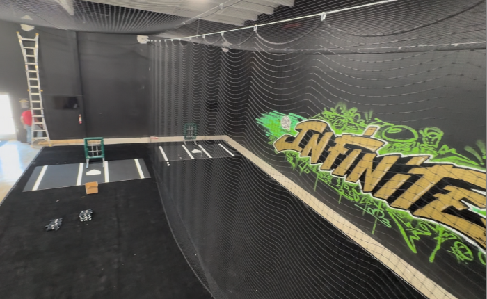 batting cage facility with black turf